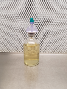 Liquid culture bottle with port
